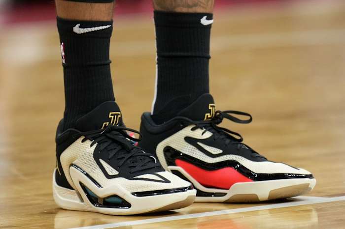 View of Jayson Tatum's white, black, and red Jordan sneakers.